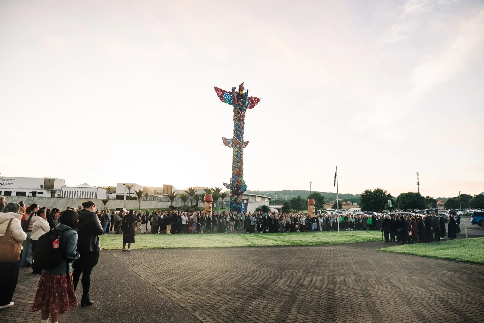 Delegates gathered at dawn beneath Pou Kapua for the pōwhiri opening the World Indigenous Cancer Conference, Due Drop Events Centre, Manukau, April 2026